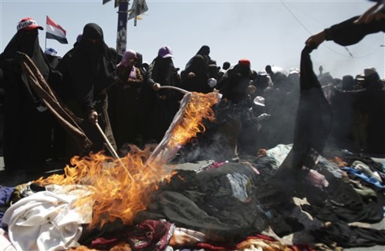 Yemeni women protesters burn their veils during a demonstration demanding the resignation of Yemeni President Ali Abdullah Saleh in Sanaa, Yemen, on Wednesday.